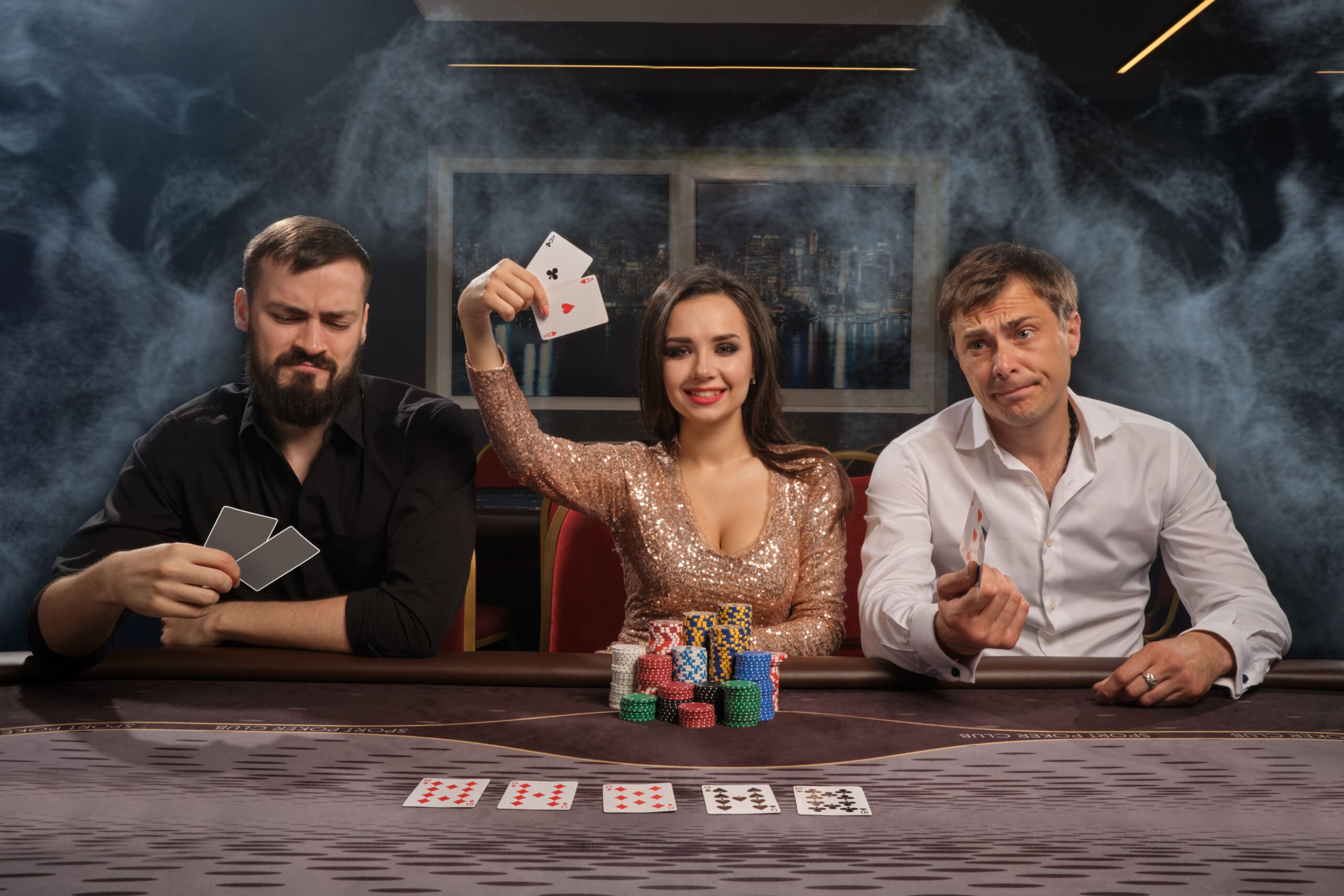 cheerful-friends-are-playing-poker-casino-smoke-girl-has-won-showing-her-cards-men-had-lost-youth-are-making-bets-waiting-huge-win-gambling-money-games-fortune (2) (1)